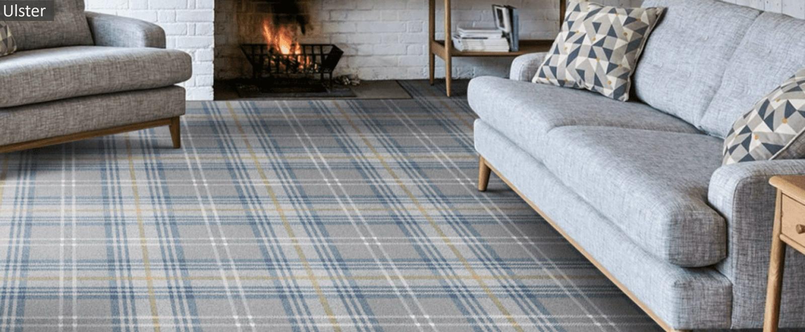 Grey, blue and gold tartan fitted carpet in a sitting room